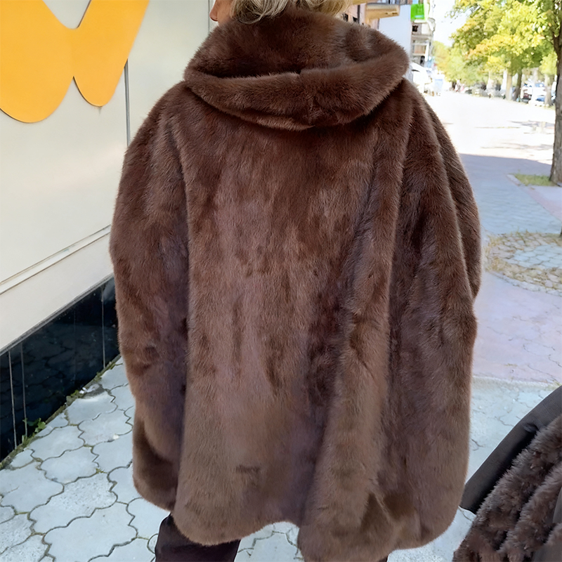 Women's oversized textured hooded winter jacket with striped sleeves