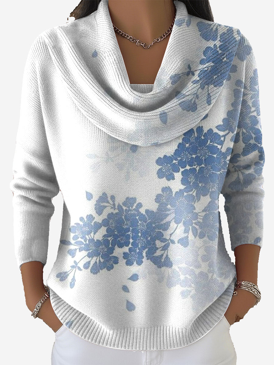 Women's white jumper with blue floral pattern and cowl neckline