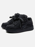 Black high-top skate sneakers with tonal camouflage side panels and lace-up fronts