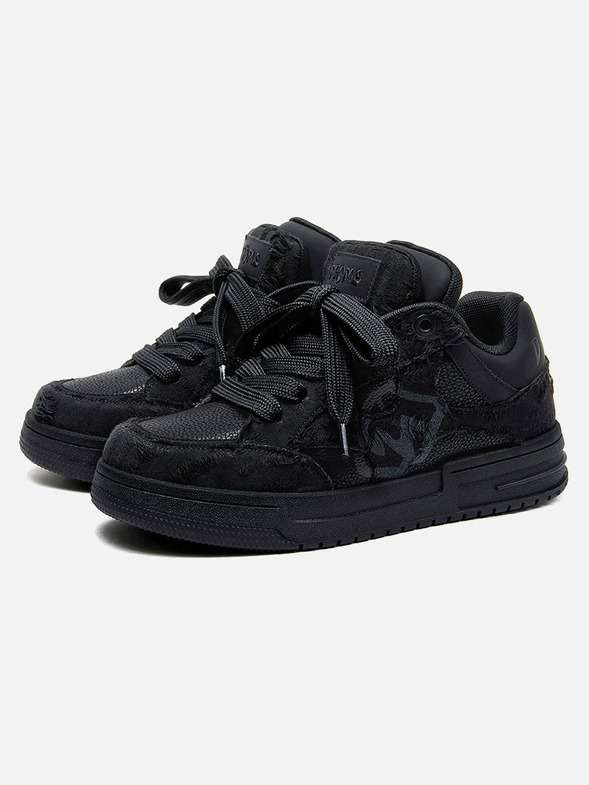 Black high-top skate sneakers with tonal camouflage side panels and lace-up fronts