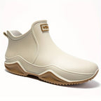 Women's slip-on ankle boots with rounded toe, pull tab and flat lug sole