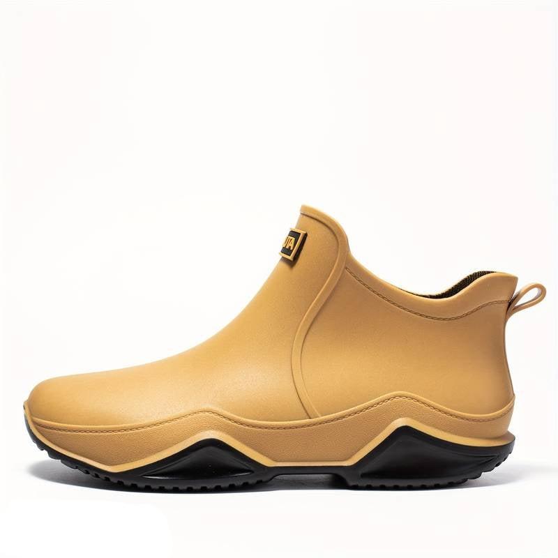 Women's slip-on ankle boots with rounded toe, pull tab and flat lug sole