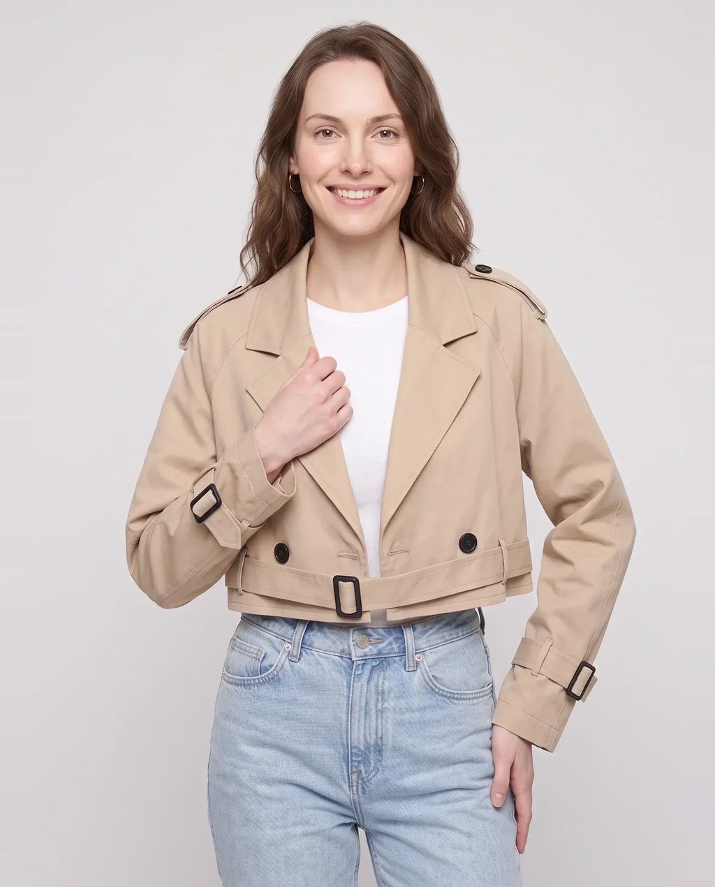 Women's beige cropped trench jacket with belt and buckle details