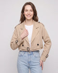 Women's beige cropped trench jacket with belt and buckle details