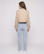 Women's beige cropped trench jacket with belt and buckle details