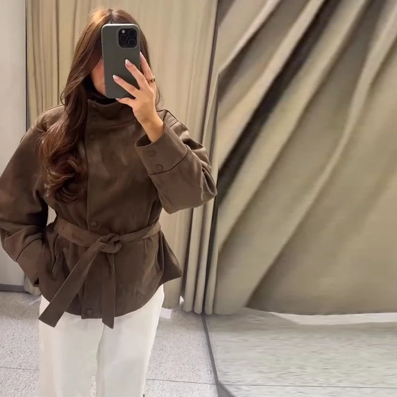 Women's brown belted jacket with high collar, long sleeves and button cuffs