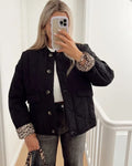 Women's quilted jacket with leopard-print cuffs, button front and flap pockets