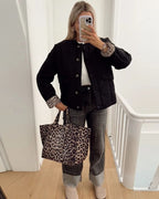 Women's quilted jacket with leopard-print cuffs, button front and flap pockets