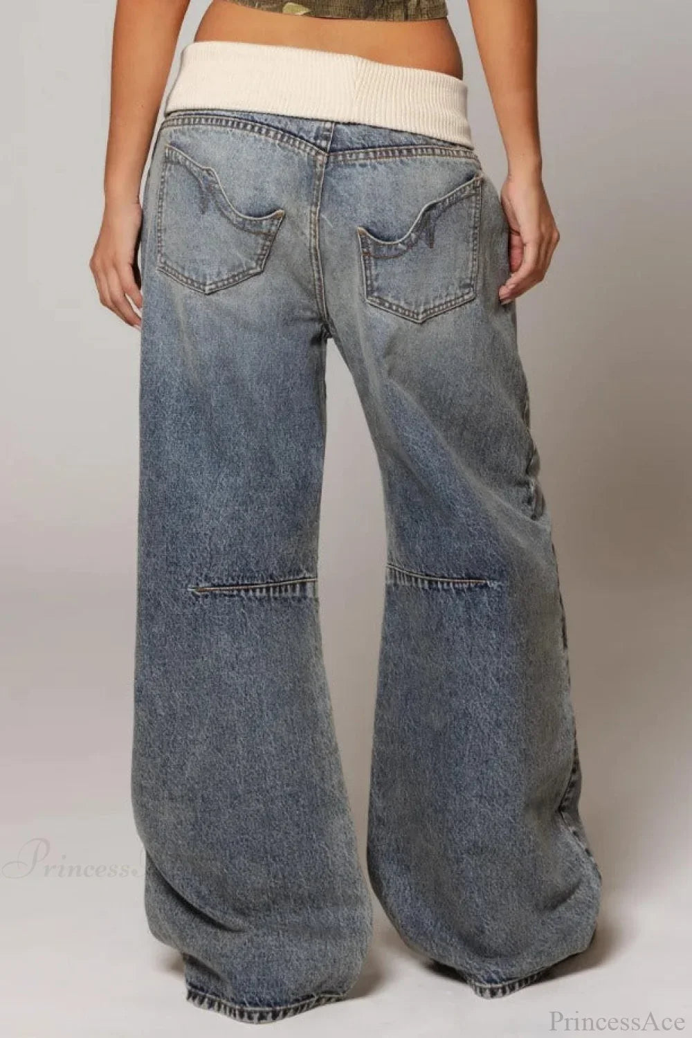 Women's washed blue wide-leg jeans with contrasting curved denim panels