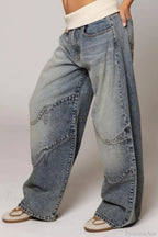 Women's washed blue wide-leg jeans with contrasting curved denim panels