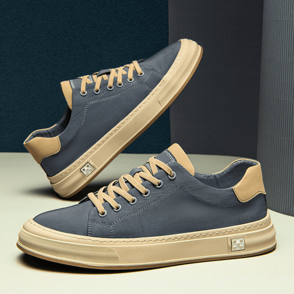 Low-top lace-up trainers with contrast sole and stitched panels