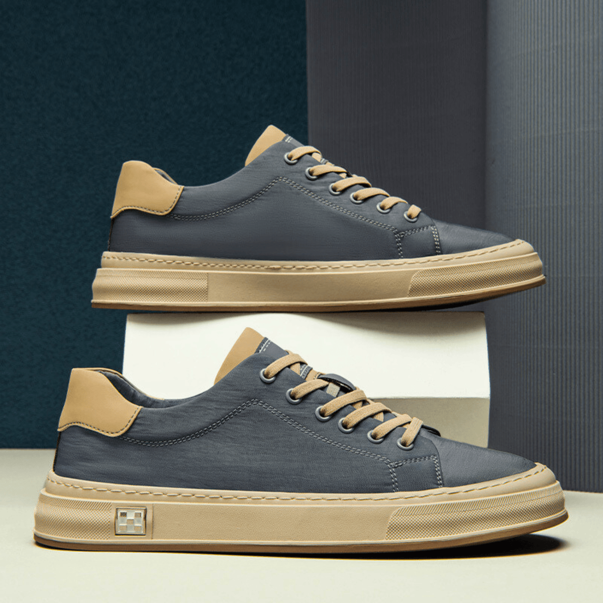 Low-top lace-up trainers with contrast sole and stitched panels