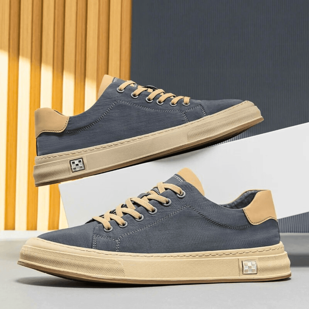Low-top lace-up trainers with contrast sole and stitched panels