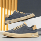 Low-top lace-up trainers with contrast sole and stitched panels
