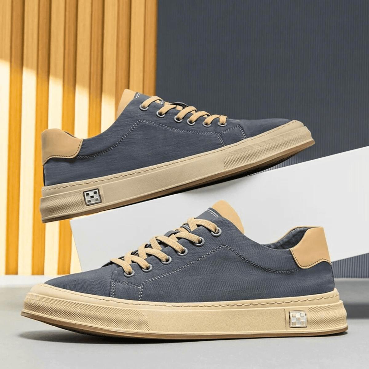Low-top lace-up trainers with contrast sole and stitched panels