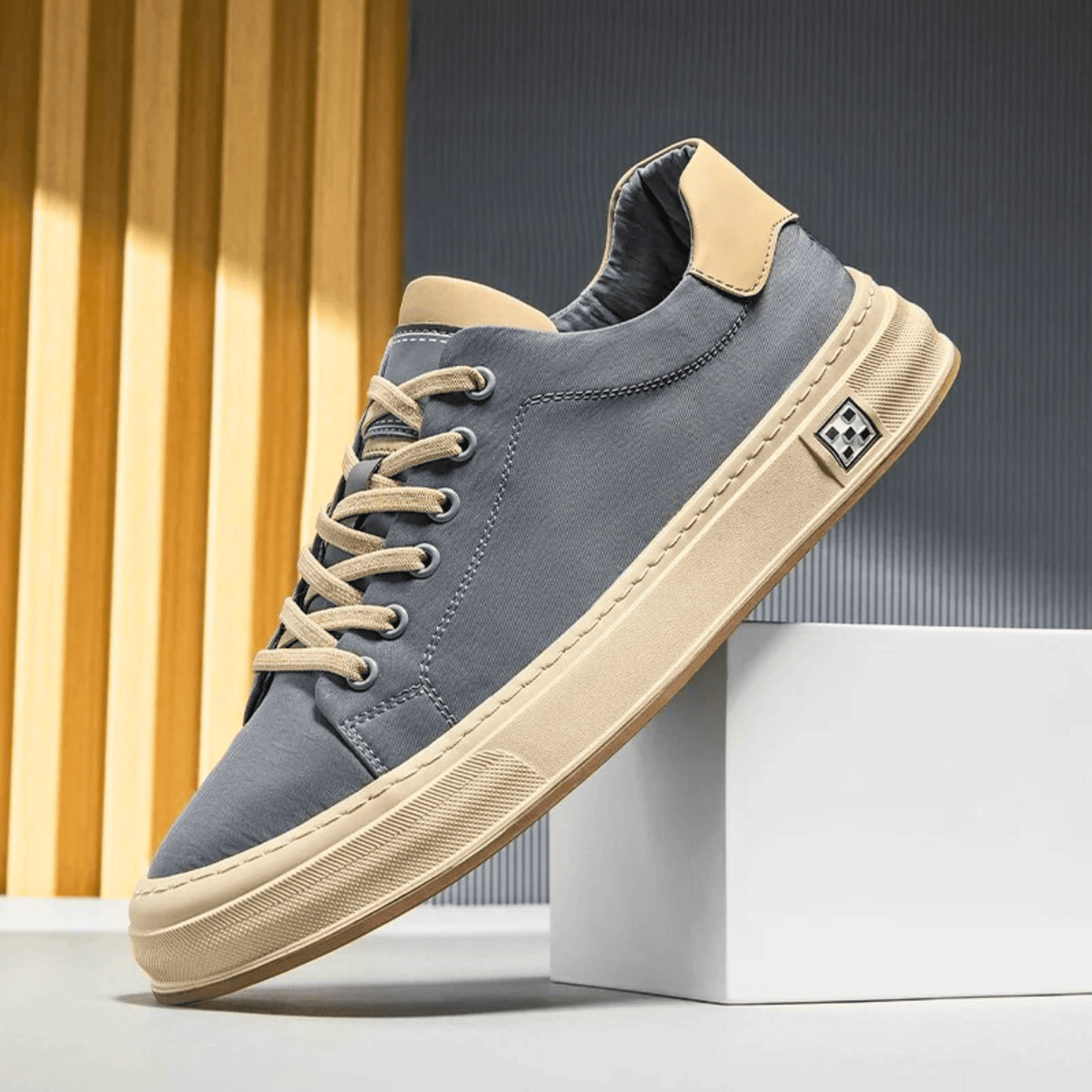 Low-top lace-up trainers with contrast sole and stitched panels