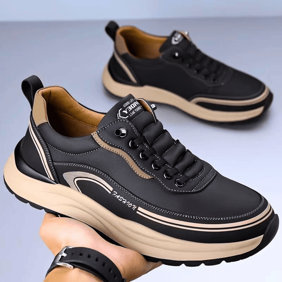 Chunky lace-up sneaker with a rounded toe, layered panels and contrast sole