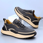 Chunky lace-up sneaker with a rounded toe, layered panels and contrast sole
