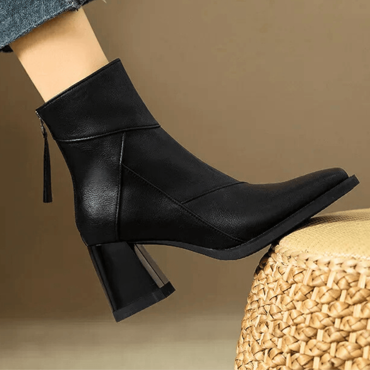 Women's pointed-toe ankle boots with tall sculpted block heels and rear zip pulls