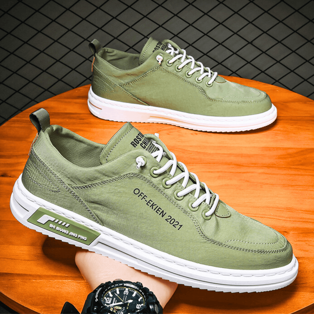 Low-top lace-up sneakers with stitched panels and contrast soles