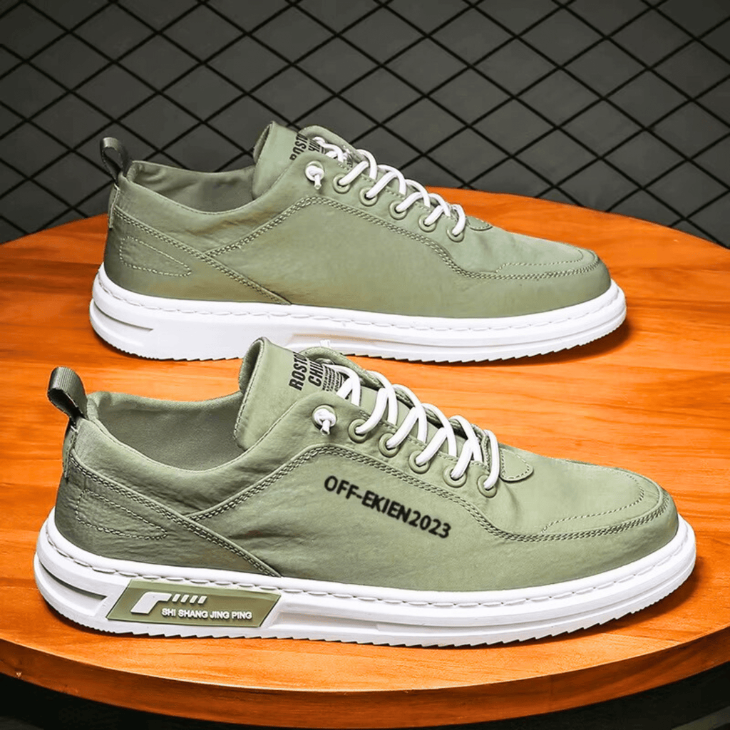 Low-top lace-up sneakers with stitched panels and contrast soles