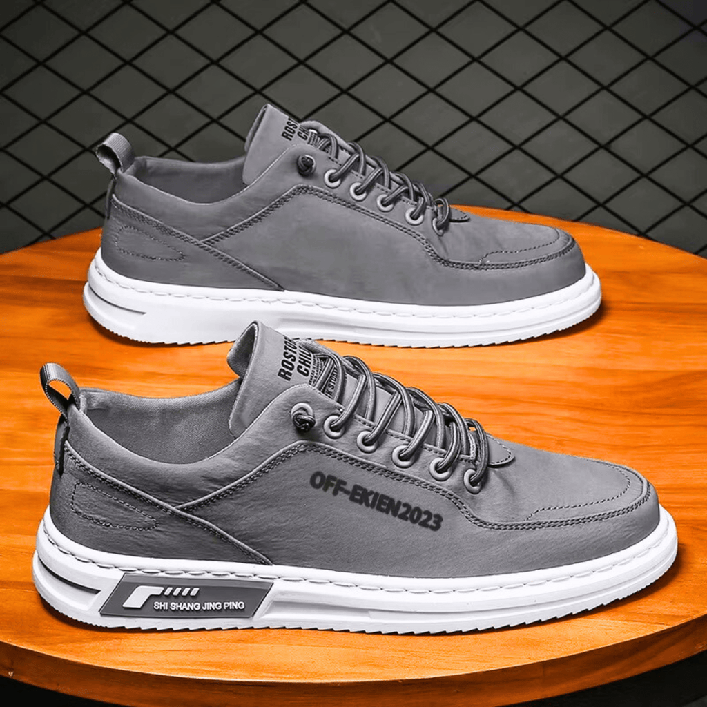 Low-top lace-up sneakers with stitched panels and contrast soles