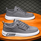 Low-top lace-up sneakers with stitched panels and contrast soles