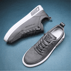 Low-top lace-up sneakers with stitched panels and contrast soles