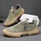 Low-top lace-up casual trainer with stitched panels and textured flat sole