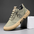 Low-top lace-up casual trainer with stitched panels and textured flat sole