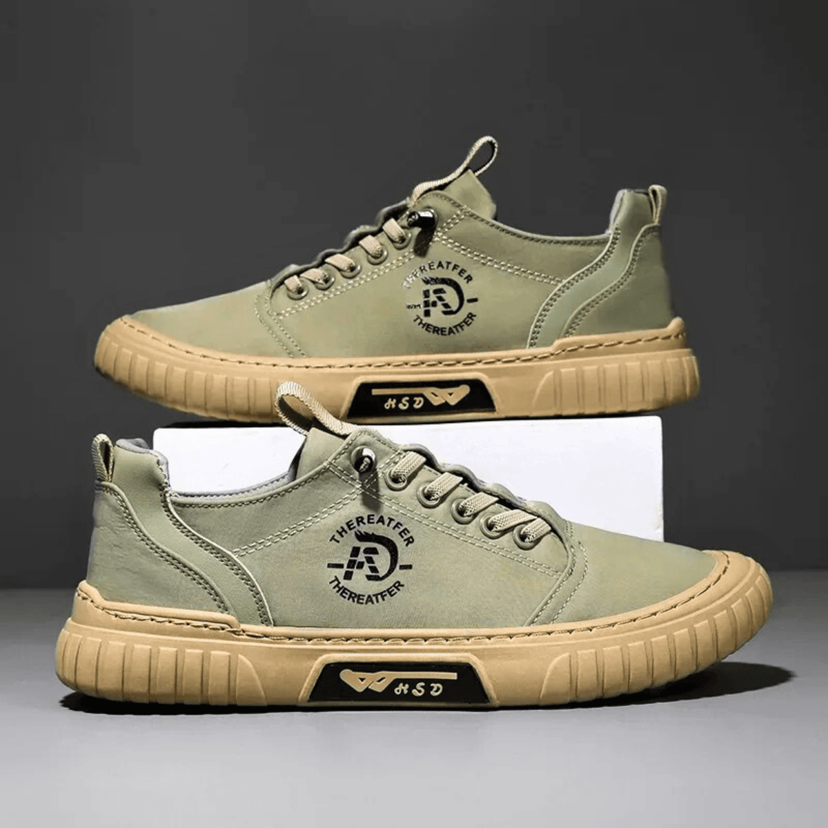 Low-top lace-up casual trainer with stitched panels and textured flat sole