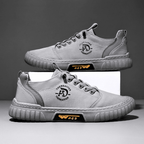 Low-top lace-up casual trainer with stitched panels and textured flat sole