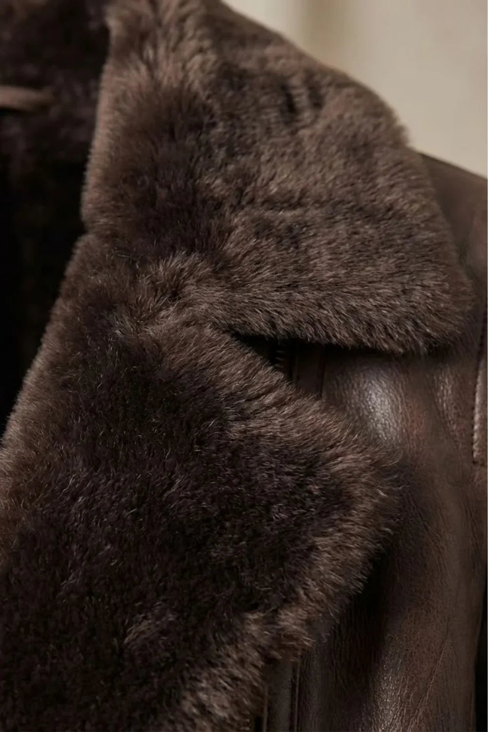 Women's brown shearling-lined jacket with plush collar and front zip