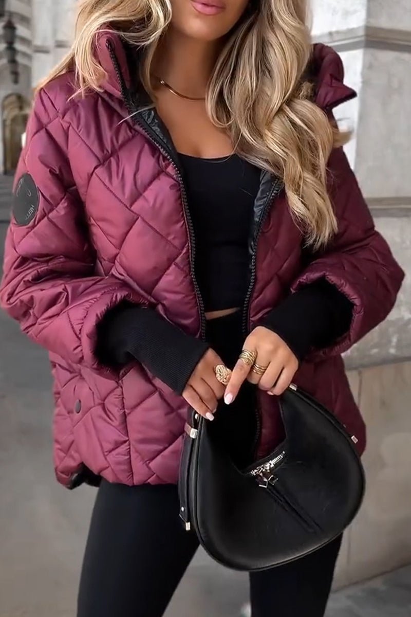 Women's oversized quilted hooded puffer jacket with long sleeves and zip front