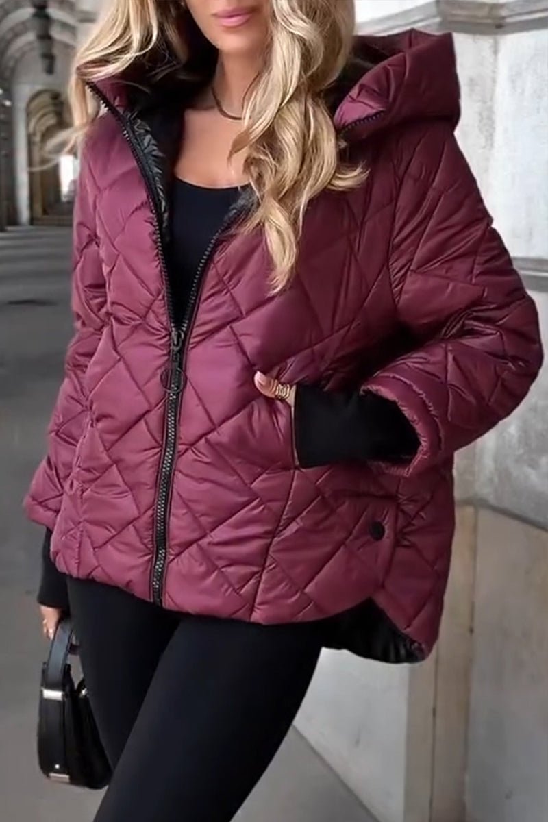 Women's oversized quilted hooded puffer jacket with long sleeves and zip front