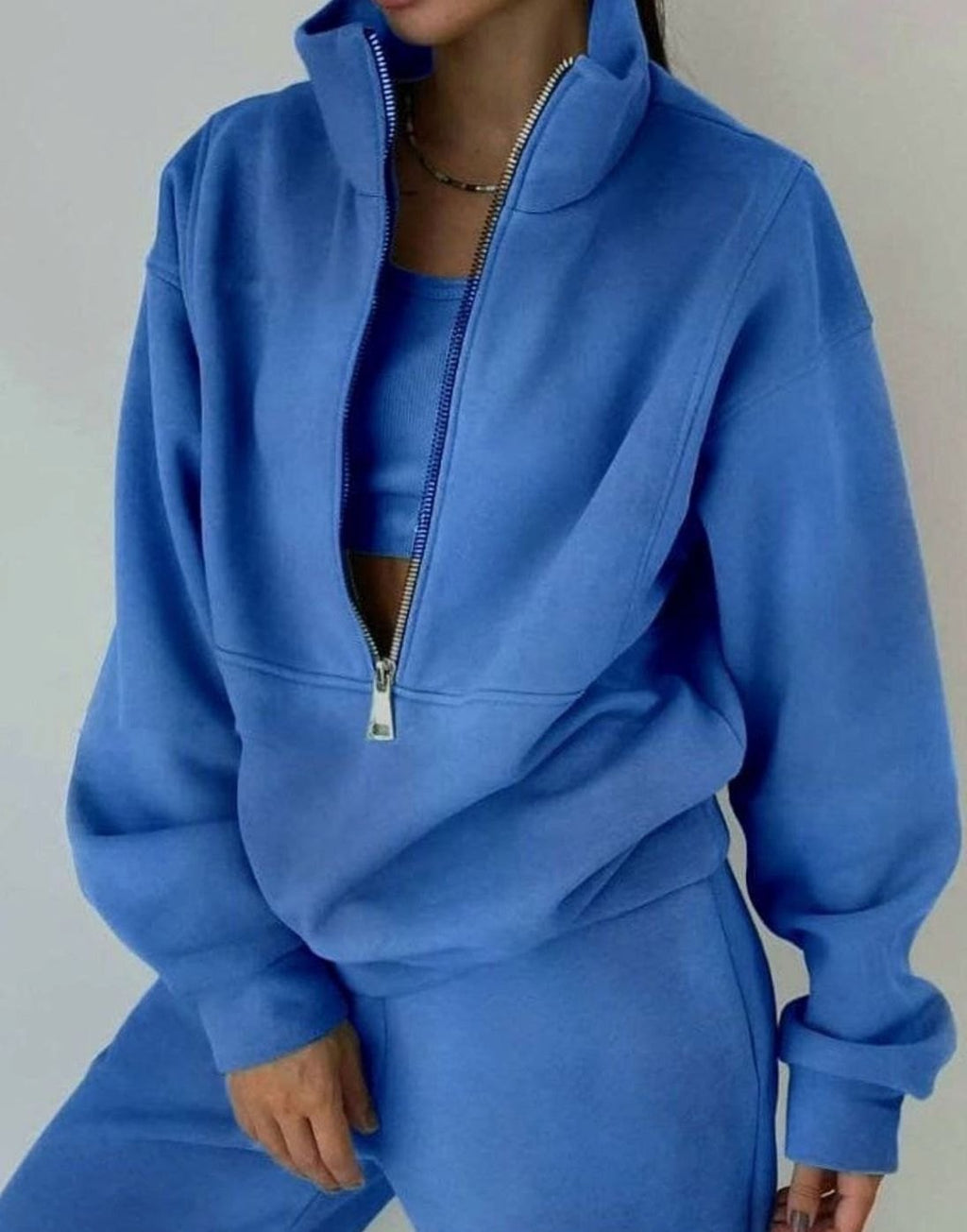 Women's cropped half-zip tracksuit set with raised collar and matching trousers