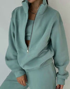 Women's cropped half-zip tracksuit set with raised collar and matching trousers