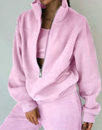 Women's cropped half-zip tracksuit set with raised collar and matching trousers
