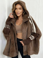Women's oversized hooded faux fur longline coat with zip front and contrast sleeve detailing