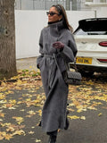 Women's grey long belted coat with raised stand collar and button front
