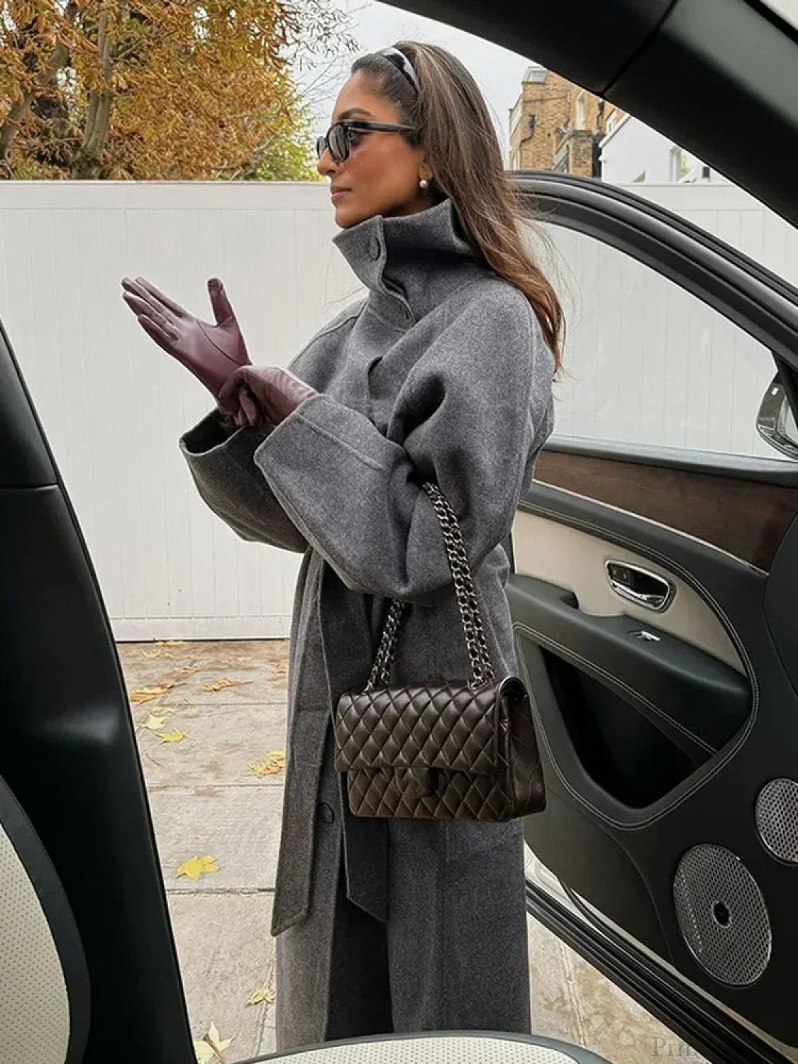 Women's grey long belted coat with raised stand collar and button front