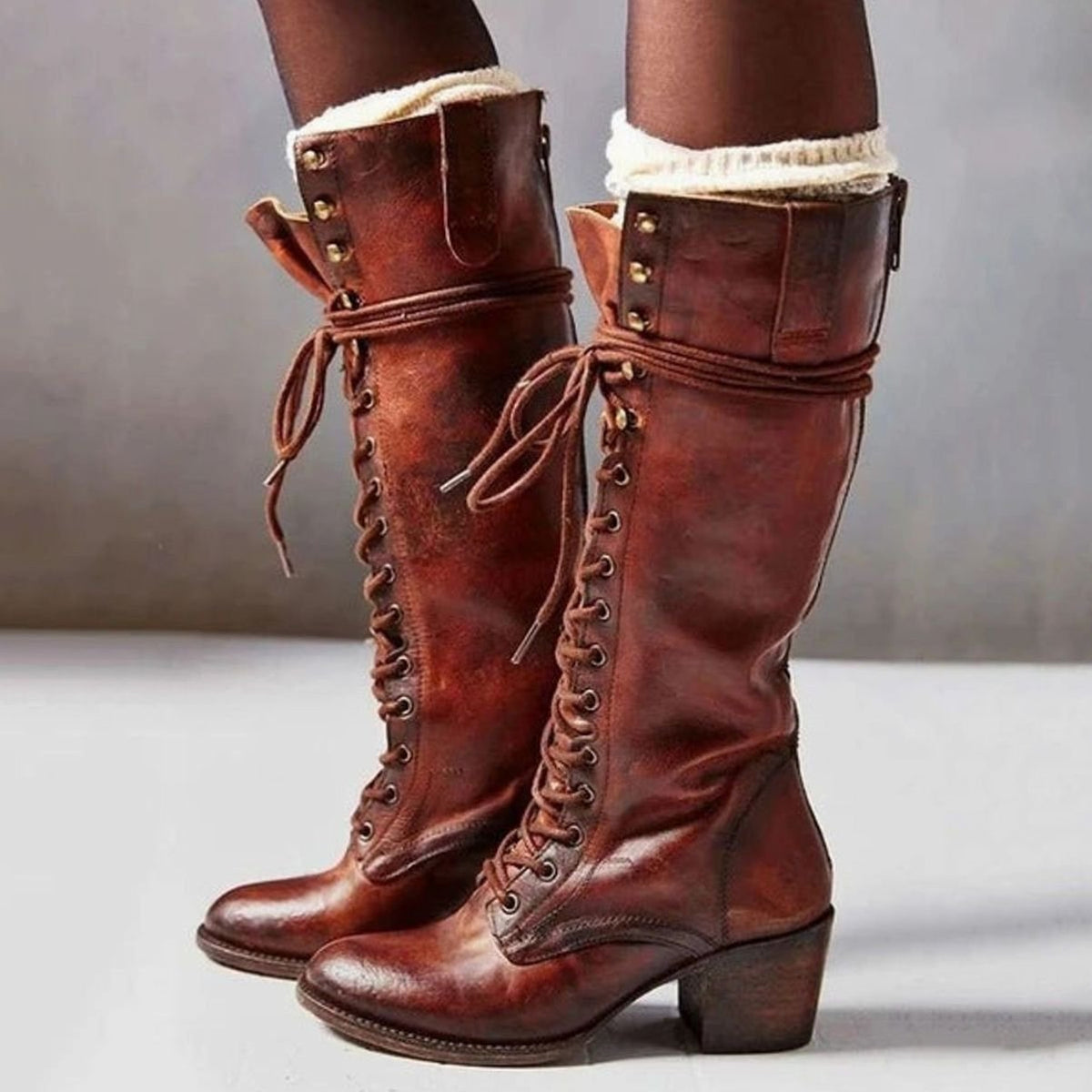 Women's knee-high lace-up boots with wraparound ankle detail and block heels