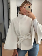 Women's belted cape coat with high collar, buttons and draped sleeves